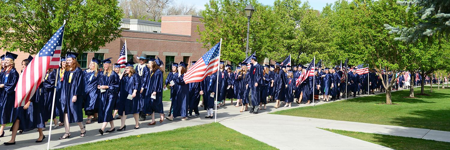 Graduating students walking past the Humanities building